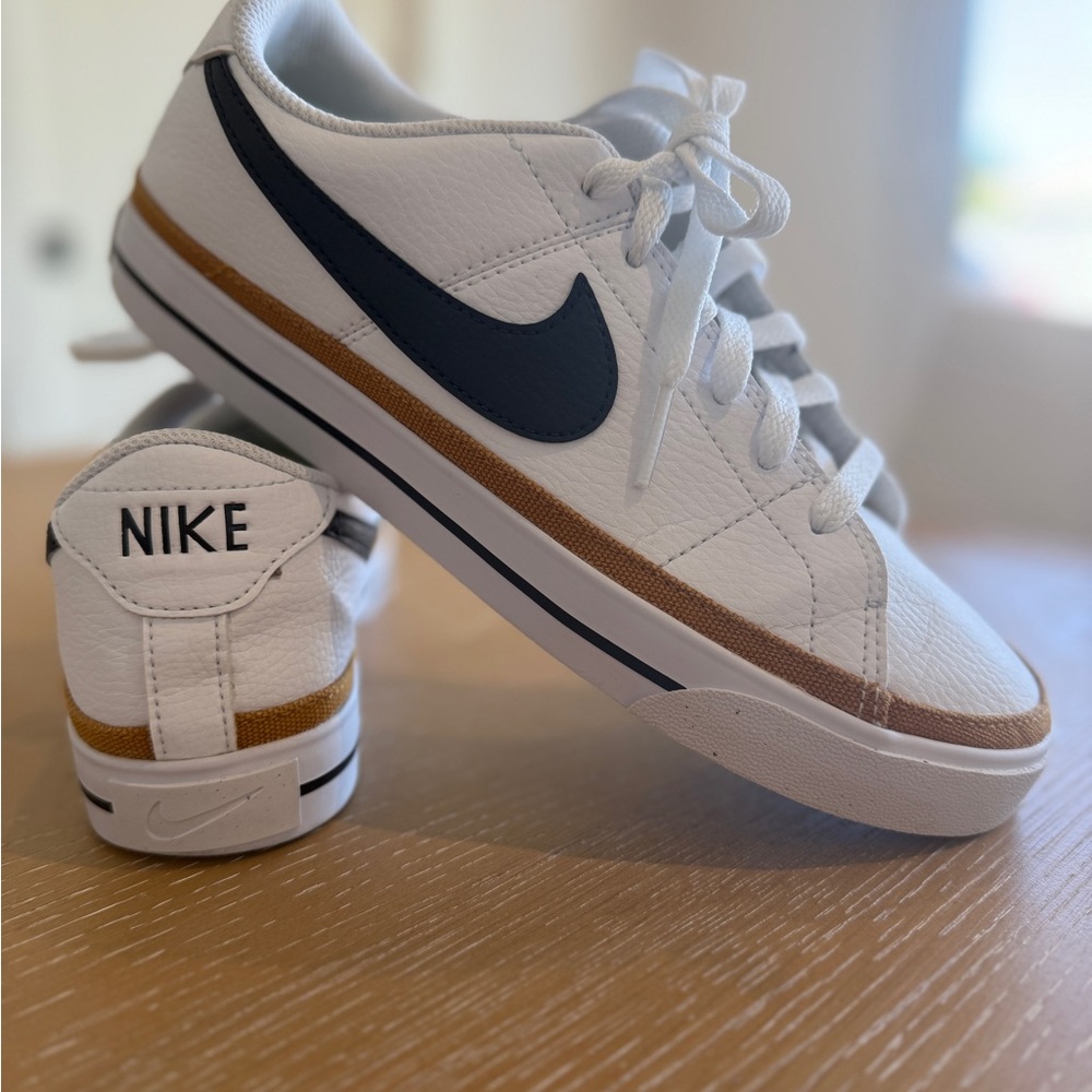 Nike White Sneakers with Black and Gold Accents